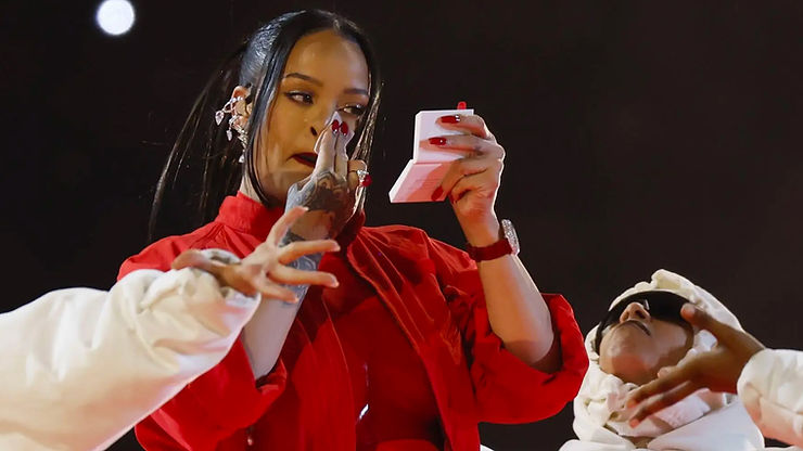 Rihanna performing at the Super Bowl with Fenty Beauty, representing contemporary R&B culture.