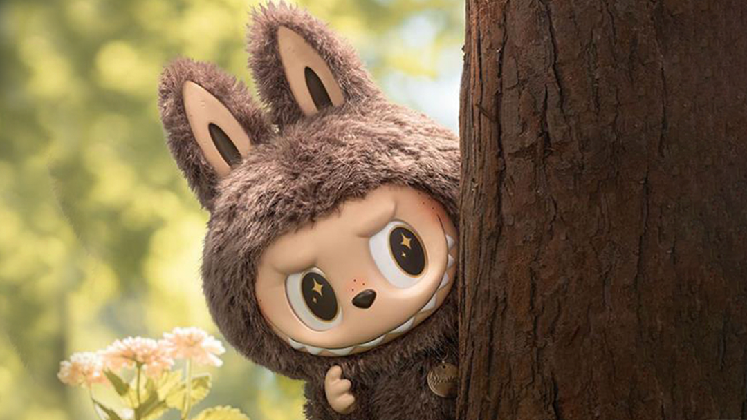 labubu trend - labubu hiding behind a tree